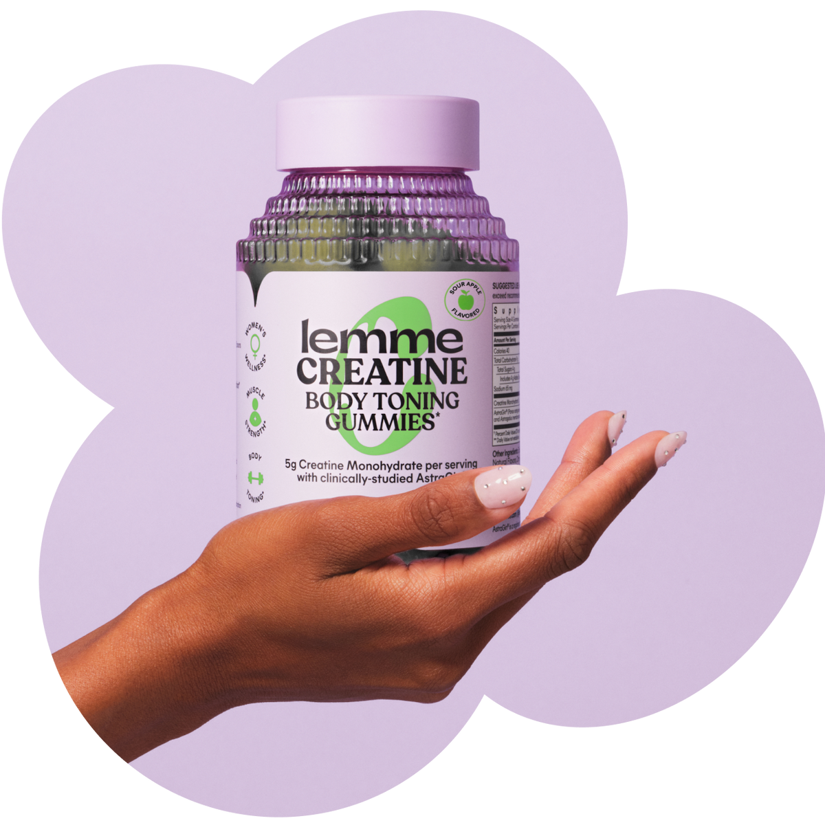 Hand holding a bottle of 'lemme' Creatine Body Toning Gummies against a light purple background