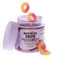 A jar of Lemme Skin Gummy Rings on a white background, with several gummy rings floating above and resting around the open container. The jar is light purple with a matching lid leaning against it, and the label reads 'lemme SKIN FIRM & HYDRATING GUMMY RINGS'.