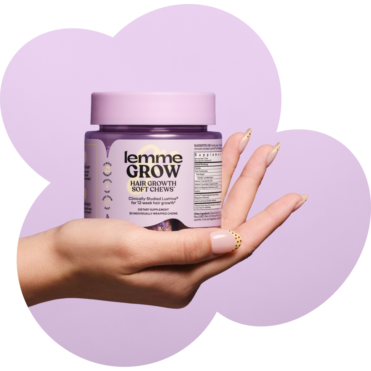 Hand holding a jar of 'lemme Grow' hair growth soft chews against a purple background