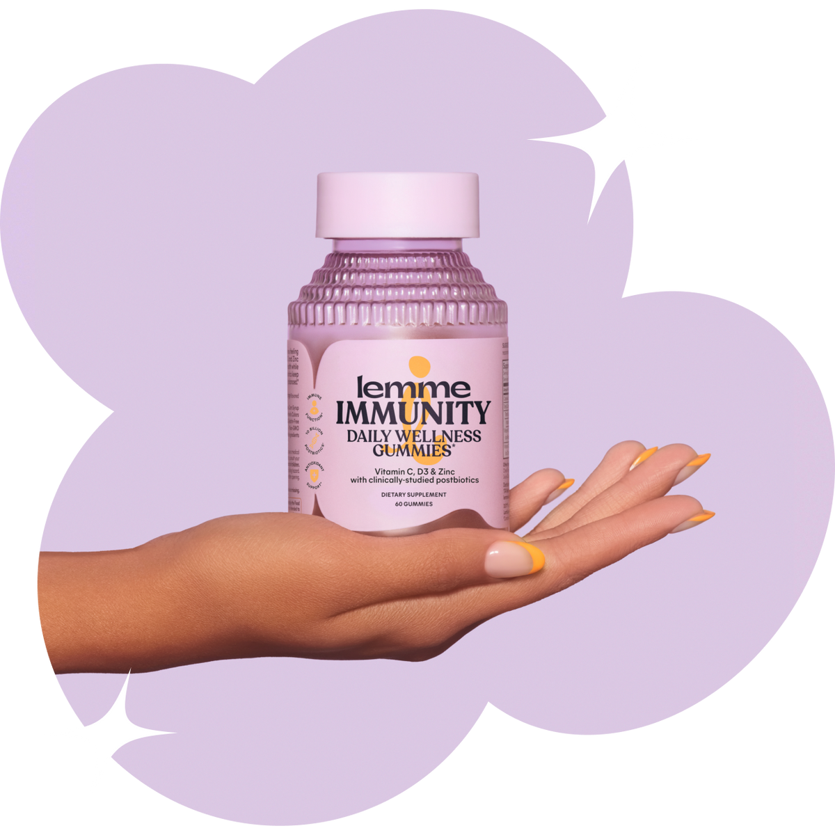 Hand holding a bottle of 'lemme IMMUNITY' daily wellness gummies against a light purple background
