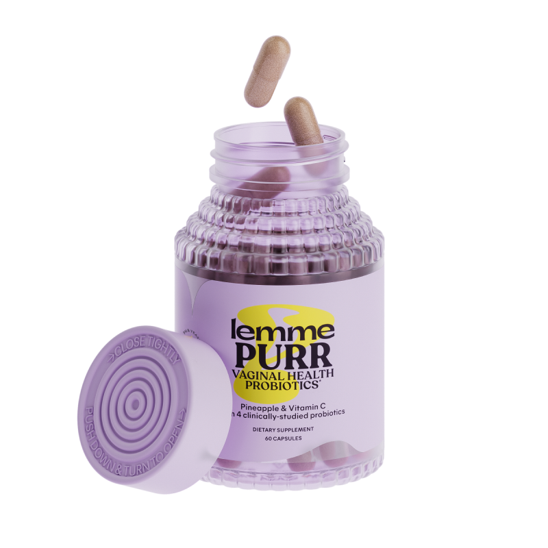 Jar of lemme PURR vaginal health probiotics with a wooden scoop on a white background
