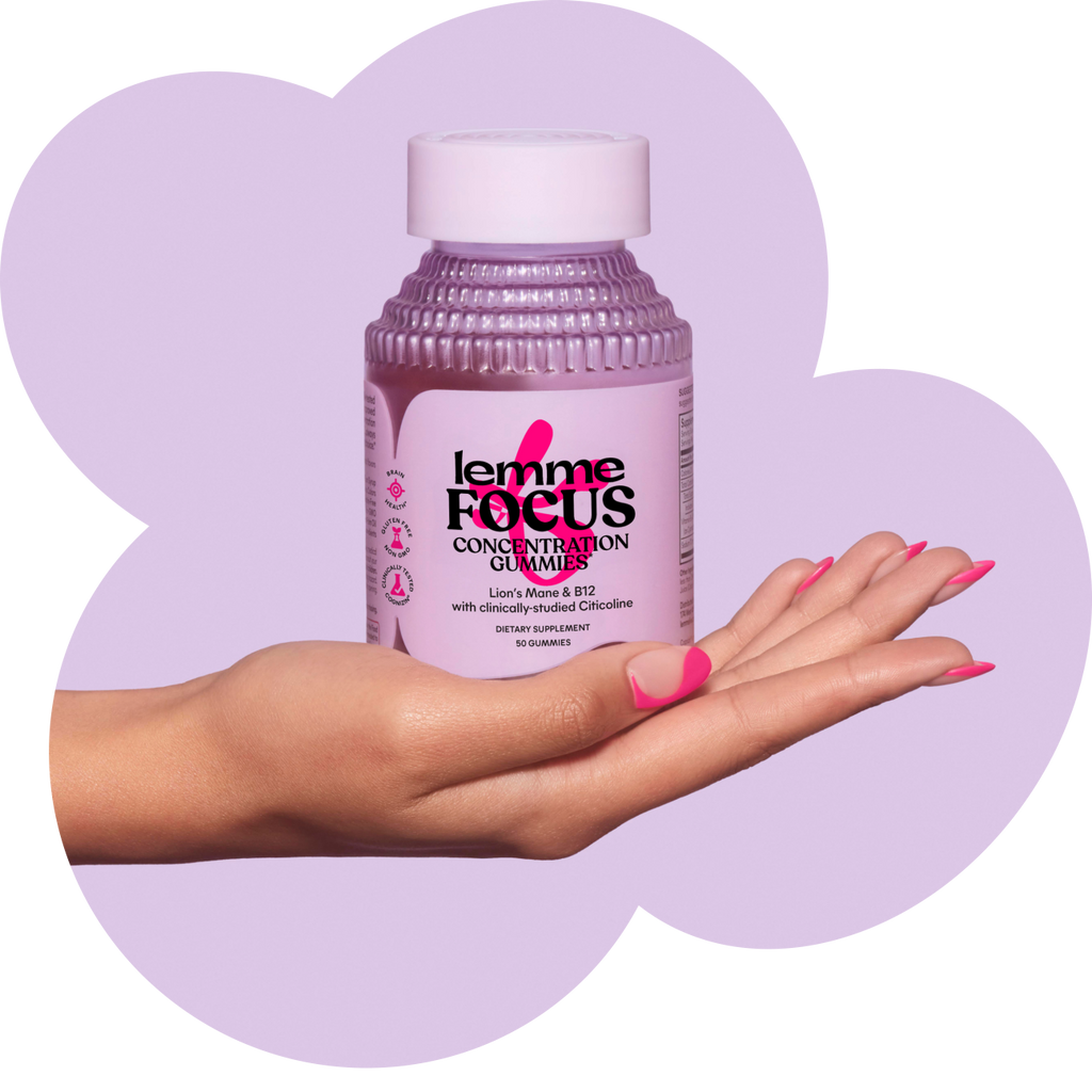 Hand holding a bottle of 'Lemme Focus' gummies against a purple background