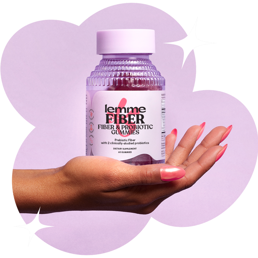 Hand holding a bottle of lemme Fiber & Probiotic Gummies against a light purple background