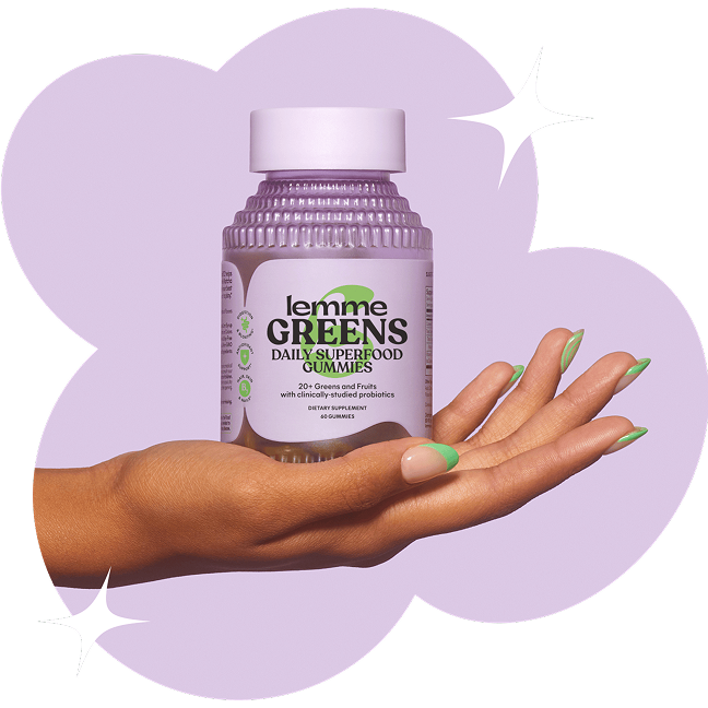 Hand holding a bottle of 'lemme GREENS' daily superfood gummies against a purple background